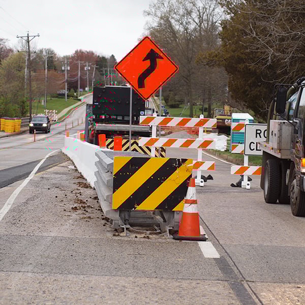 Temporary traffic control and lane shift management using MUTCD signage, barricades, and cones in active construction work zone